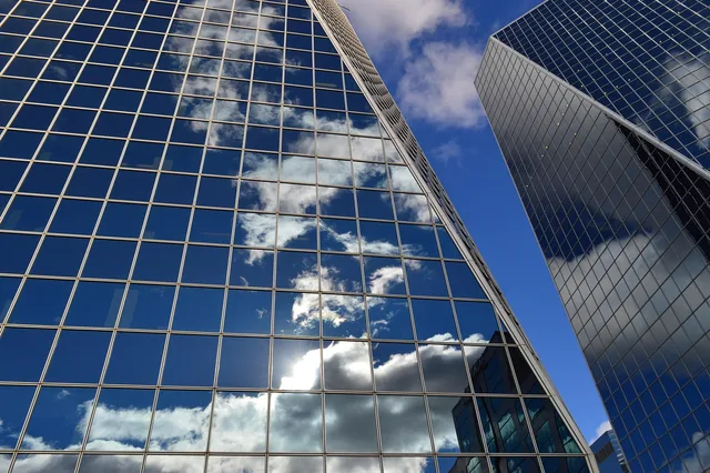 buildings, clouds, reflection, glass, windows, blue, architecture, urban, modern, office, facade, exterior, high, commercial, downtown, corporate, structure, city, skyscrapers, towers, blue business, nature, blue office, blue window, blue glass, blue company, blue glasses. Commercial buying: risks, safeguards and decisions, in plain terms