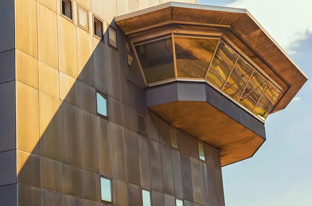 building, architecture, facade, real estate, exterior, modern building, office building, residential building, apartment, windows. Commercial lease or buying workspace in the US: the cost lines to model yourself