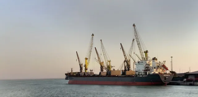 bulk ship, iran port, ship crane, cargo hold, transportation, harbor, sailing, freight, crane, sunrise, port, charge, water, industry, transport, vessel, m v abraham m, warehouse, loading, travel, nature, sky, vehicle, shipping, export, life boat. Inland Empire, Dallas and Atlanta industrial leasing along freight corridors
