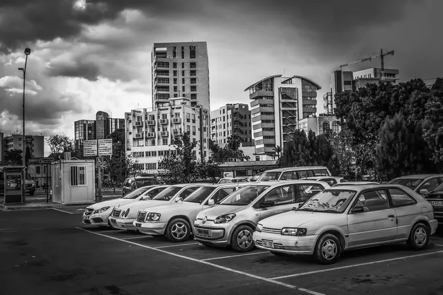 parking lot, cars, vehicles, city, cityscape, nature, building, modern, downtown, town, architecture, city life, sky, clouds, grey, urban, gray life. 6 things to weigh up on location selection rules