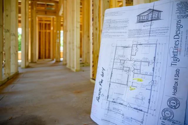 Construction is moving swiftly new. Which document would have caught each tenant improvements mistake?